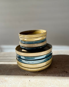 Handmade ceramic plates in glossy beige by Nathalie Merian